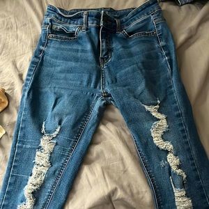 Dark blue ripped jeans good condition.